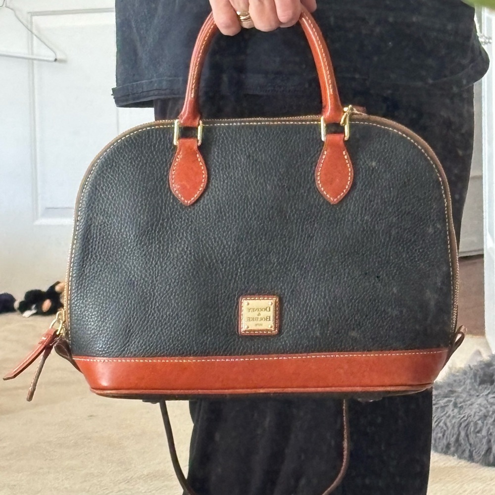 Dooney and Burke Pebble Grain Zip Zip Satchel. Black w/ brown leather accents.